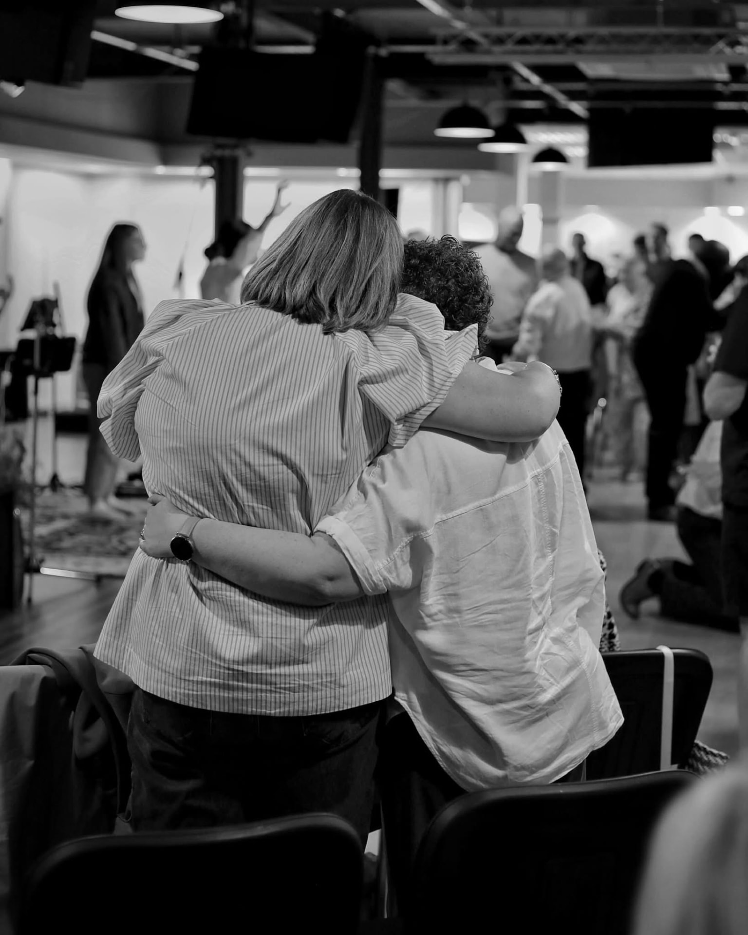 Two women embracing at Anchor Church
